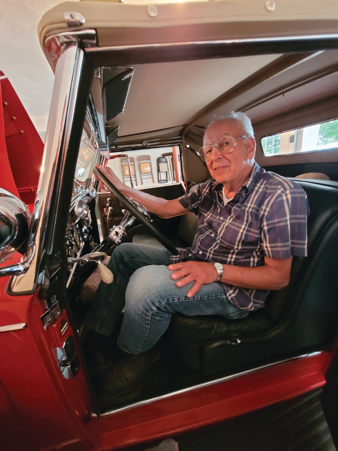 TIME TO CRUISE: John Ricci takes a seat behind the wheel of his 1934 Cadillac. This weekend, he’ll be driving the car that he restored to Newport to compete in the Concours d’Elegance.